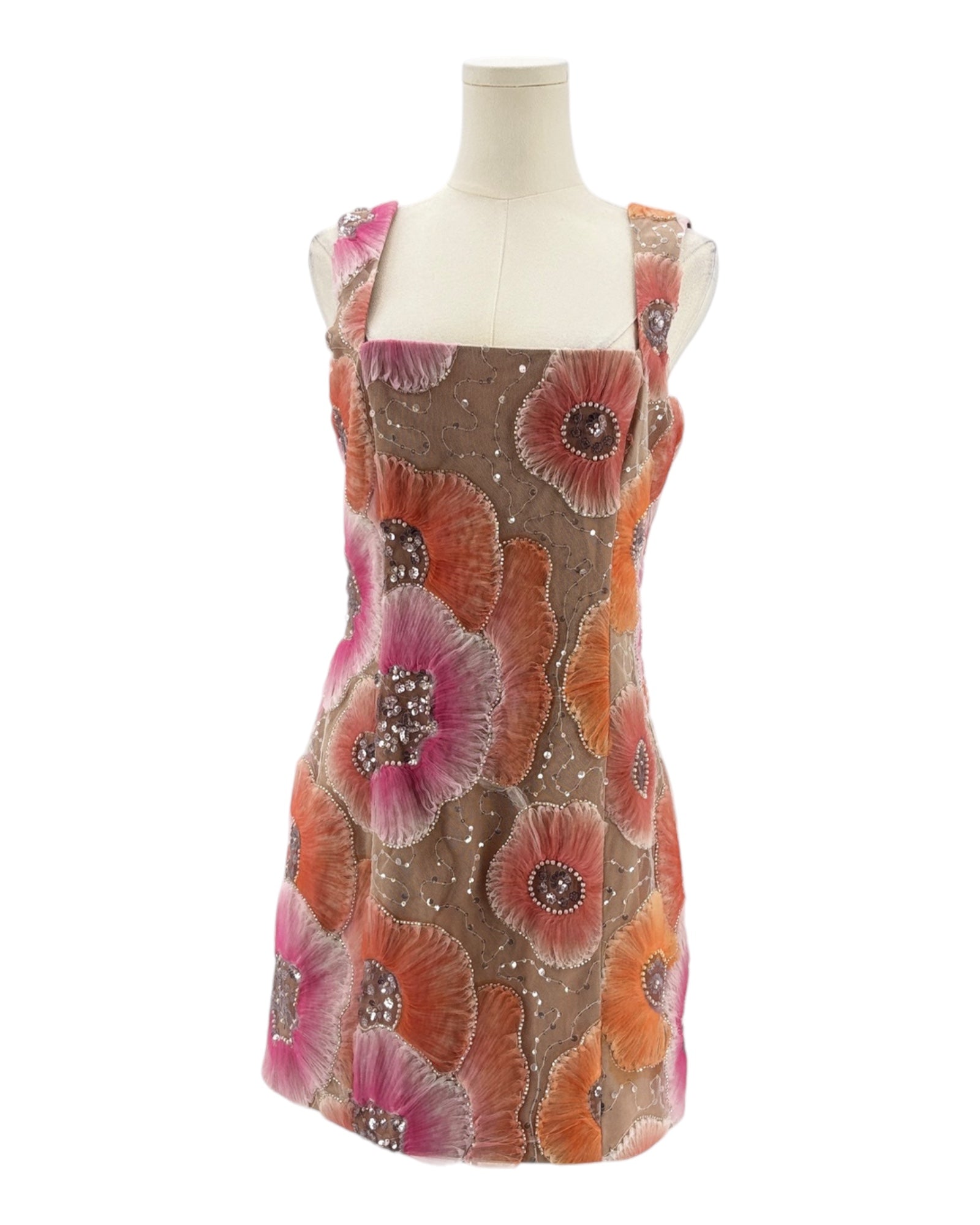 Floral patterned dress on a mannequin against a white background