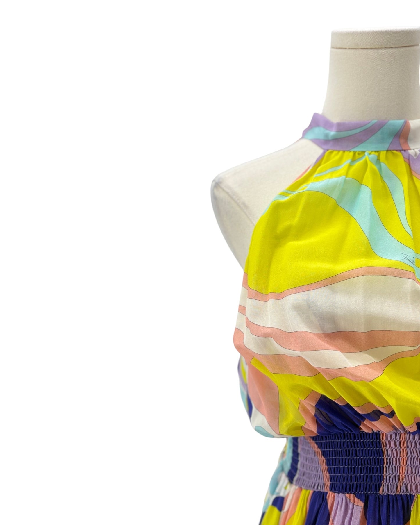 Colorful striped dress on a mannequin against a white background
