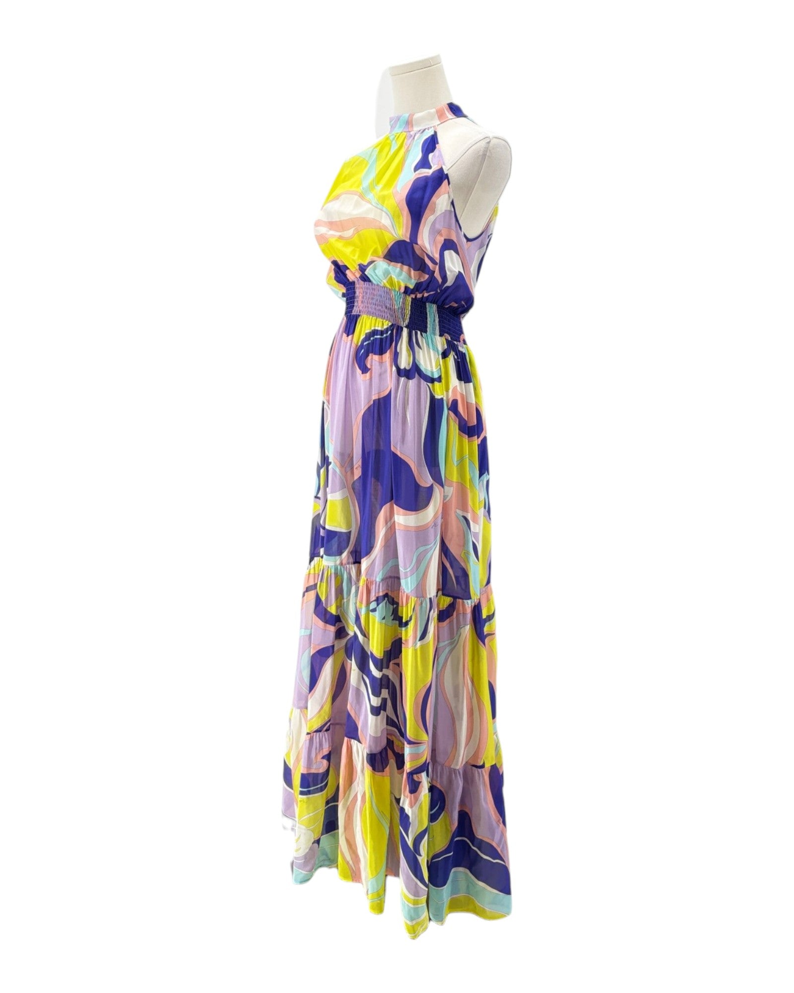 Colorful dress on a mannequin against a white background