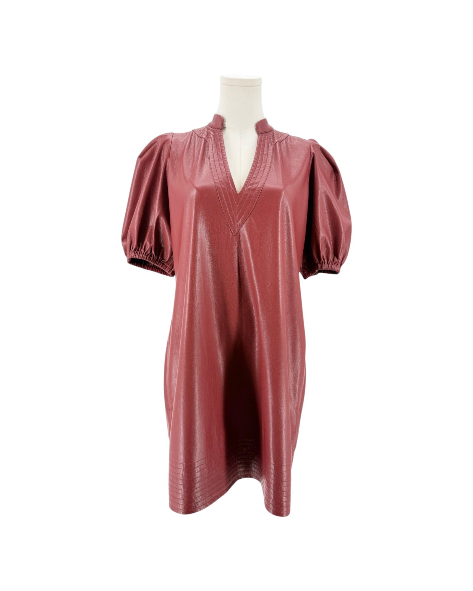 A brick red faux leather mini dress with puff sleeves and a split V-neckline, displayed on a mannequin torso against a white background.