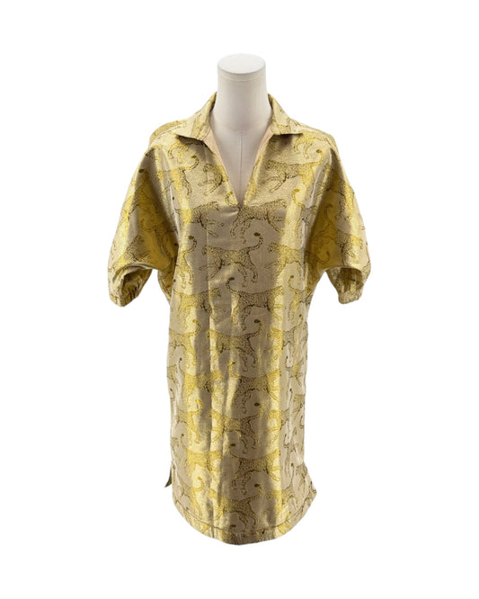Gold patterned shirt on a mannequin against a white background