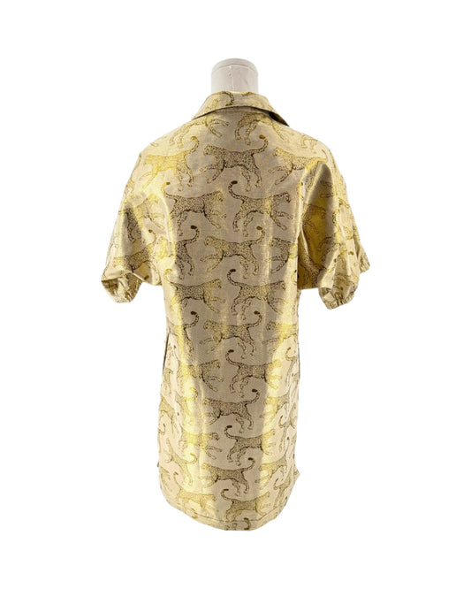 Mannequin wearing a yellow and animal patterned robe on a white background