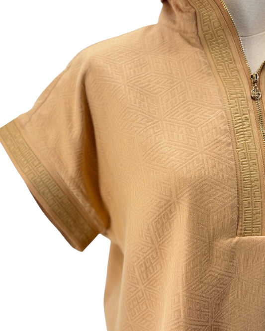Gold textured shirt with a zipper on a white background