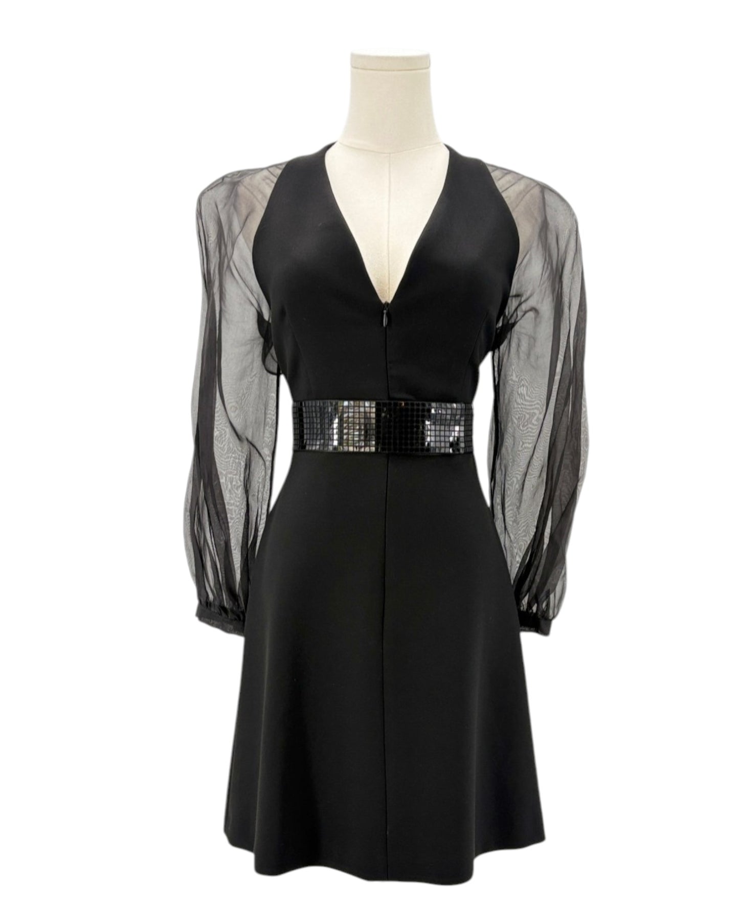 Black dress with sheer sleeves on a mannequin against a white background