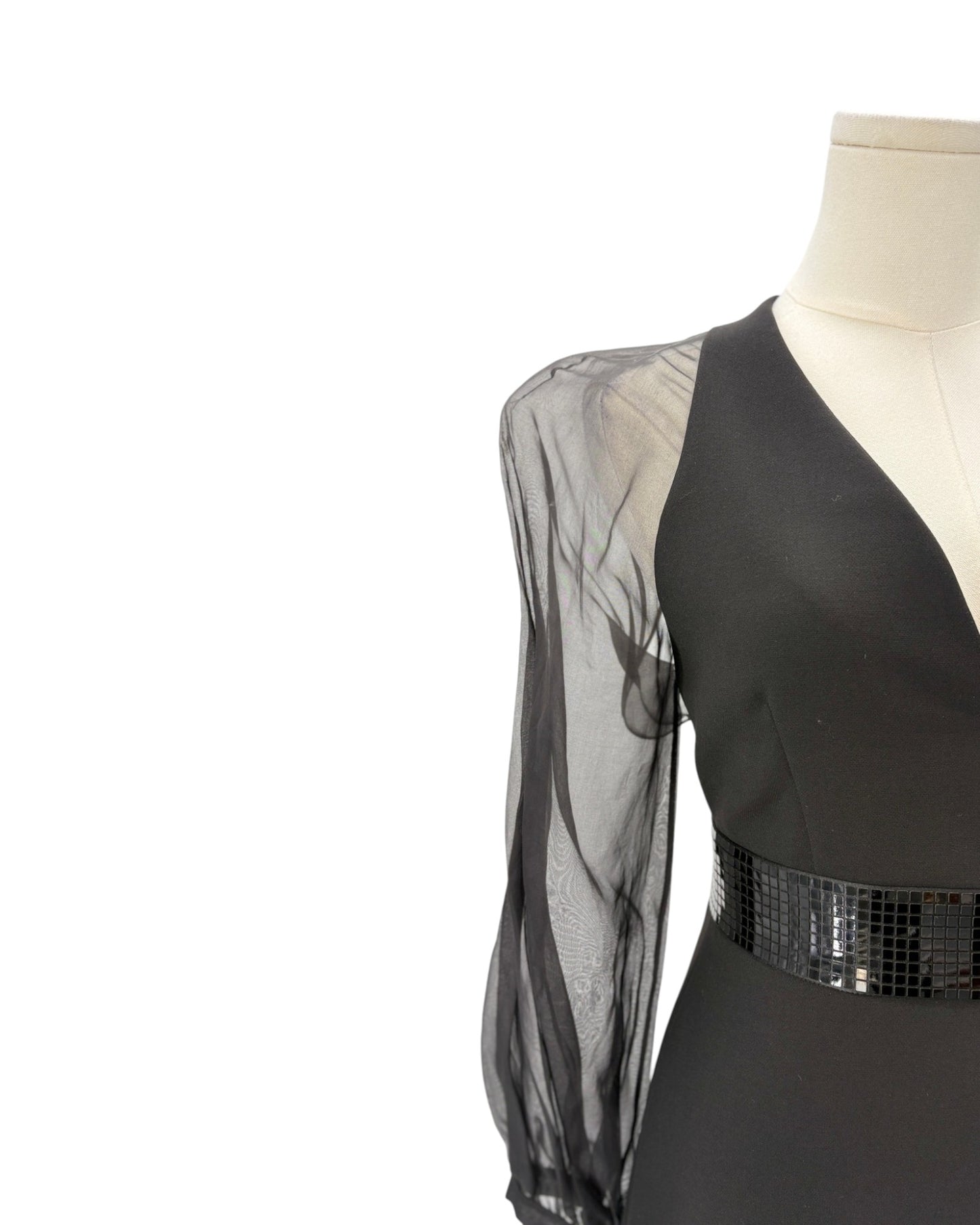 Black dress with sheer sleeves on a mannequin against a white background