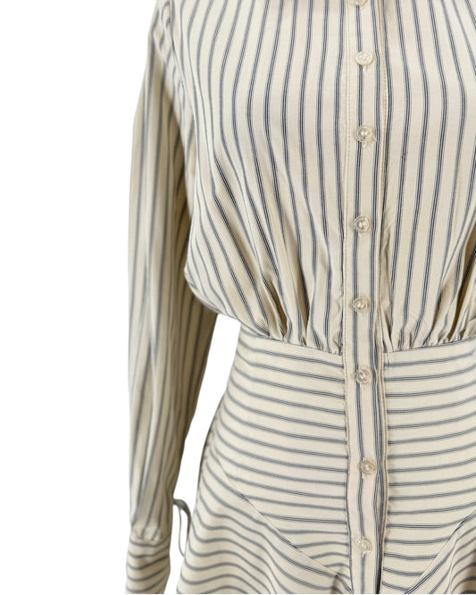 Striped shirt dress, point collar, clean button-front placket closure, distinct smocked and gathered detailing, long sleeves detailed with adjustable drawstring/tie accent at cuffs on a mannequin on a white background