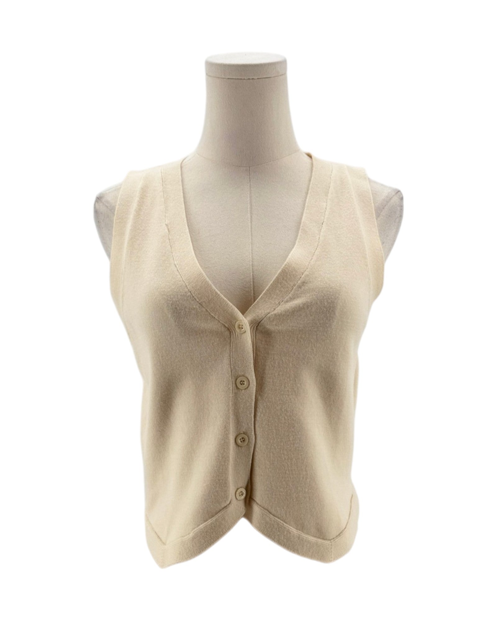 Beige knit vest on a mannequin against a white background