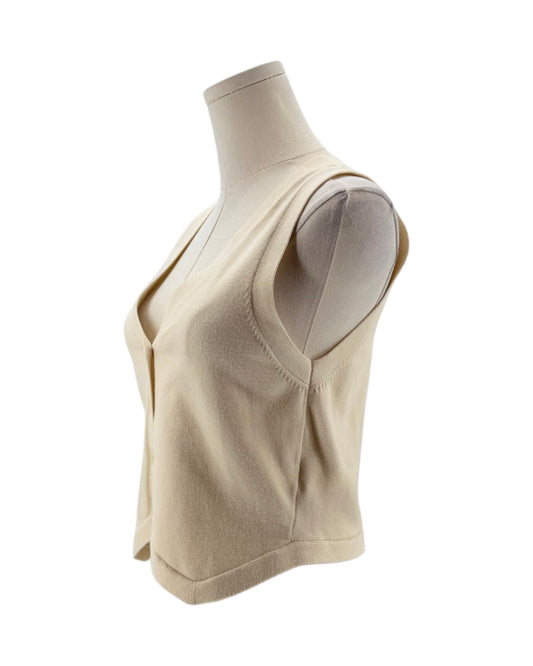 Beige sleeveless top on a mannequin against a white background