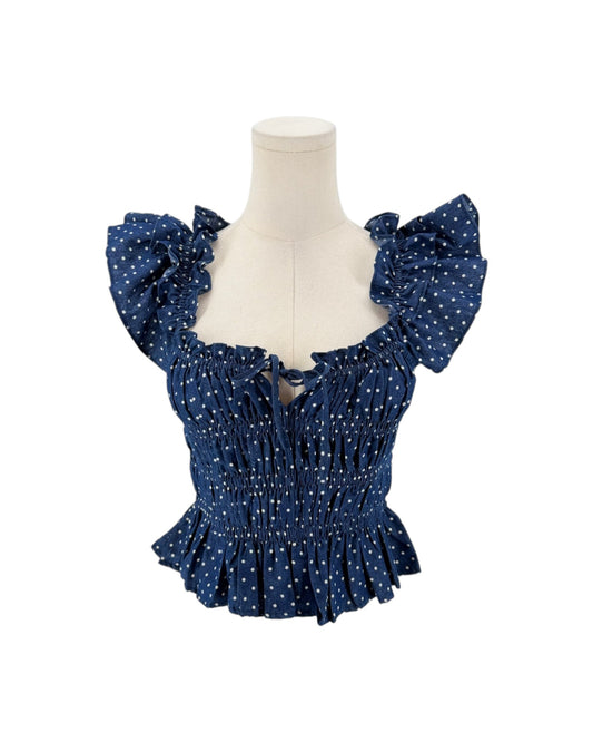 Blue polka dot flutter sleeve top on a white background