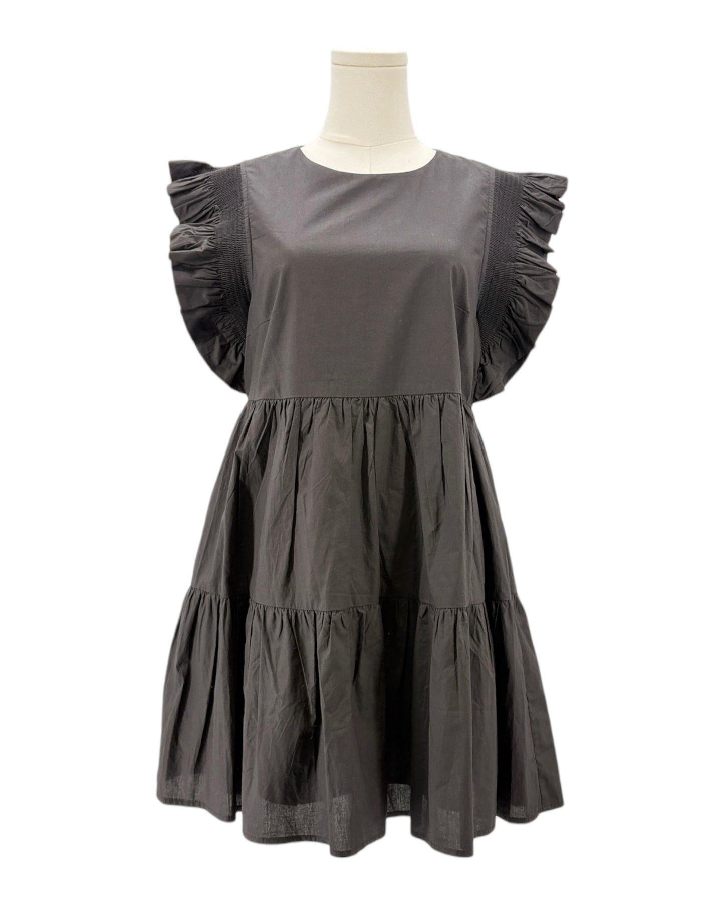 Black dress on a mannequin against a white background