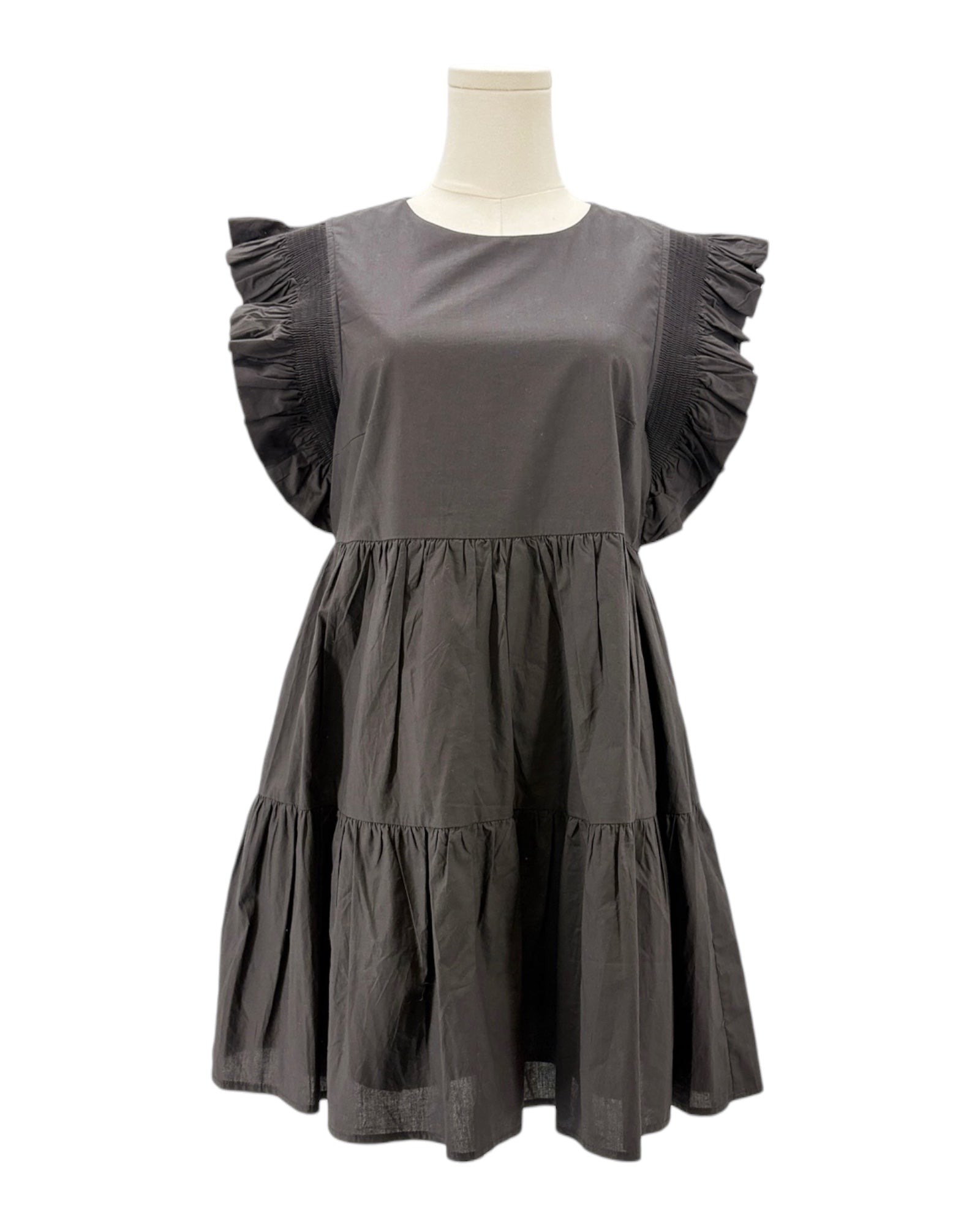 Black dress on a mannequin against a white background