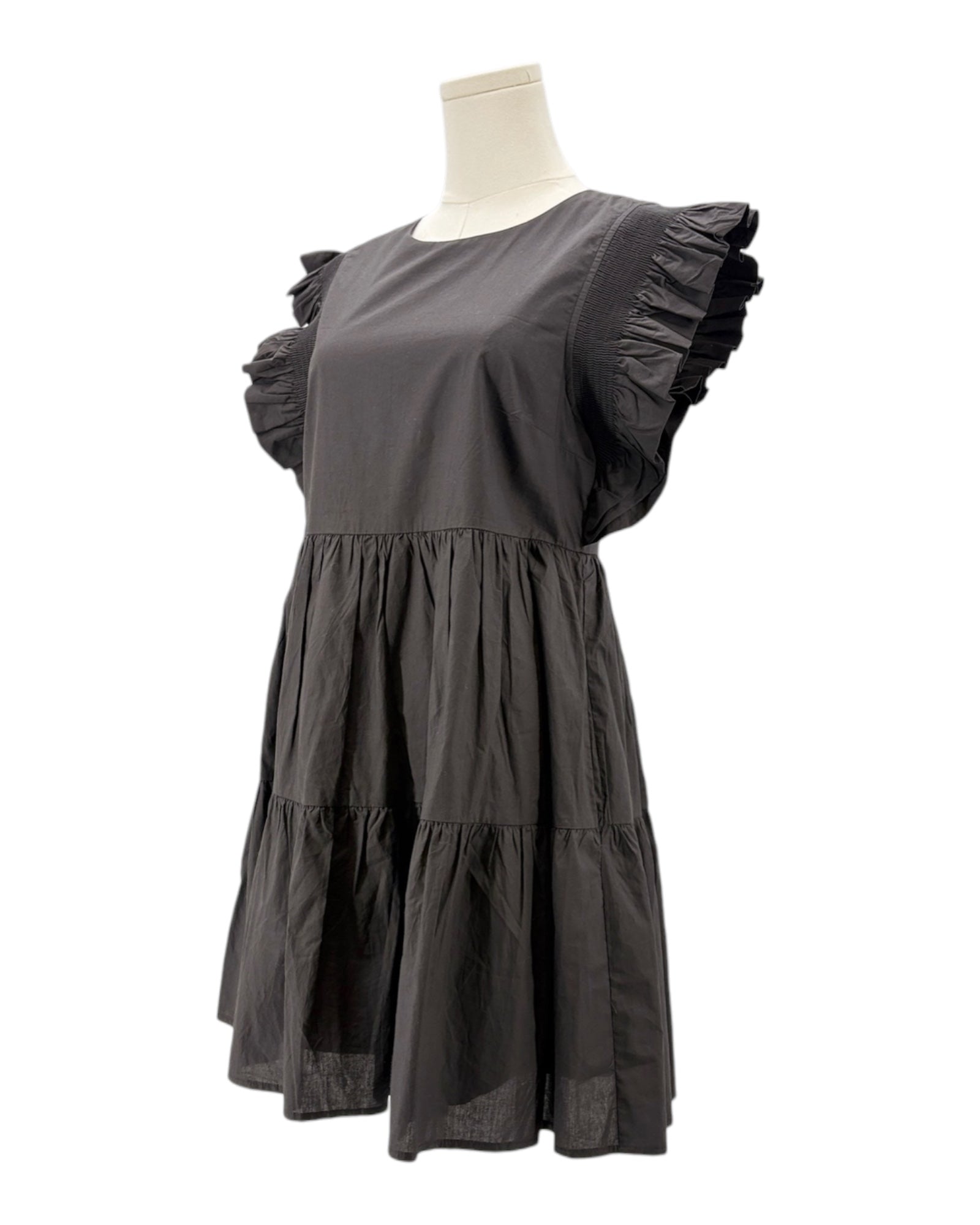 Black dress on a mannequin against a white background