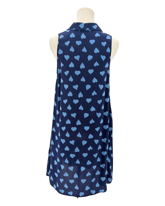 Navy sleeveless button down shirt with blue heart pattern on a mannequin against a white background