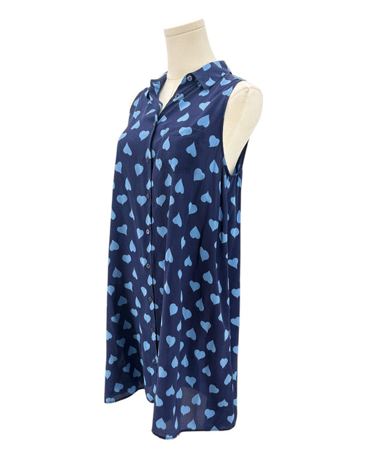 Navy sleeveless button down shirt with blue heart pattern on a mannequin against a white background