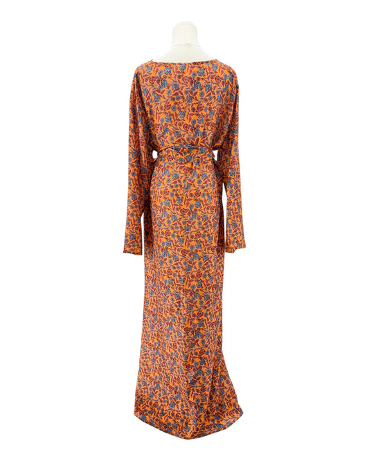 Long-sleeve dress with orange and blue pattern on a mannequin against a white background