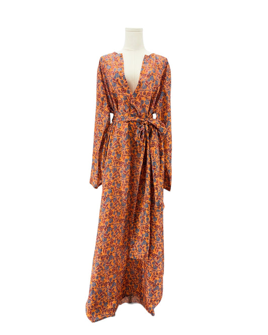 Orange and blue patterned dress on a mannequin against a white background