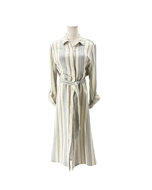 A long-sleeve collared shirt dress with vertical stripes in beige, gray, and muted blue, featuring a matching tie belt, displayed on a mannequin against a plain white background.