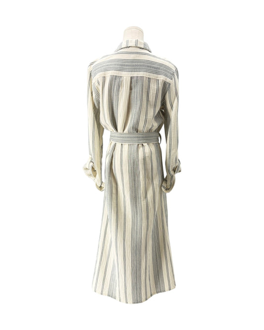 A long-sleeve belted shirt dress with vertical stripes in cream, beige, and gray, displayed on a mannequin from the back against a white background.