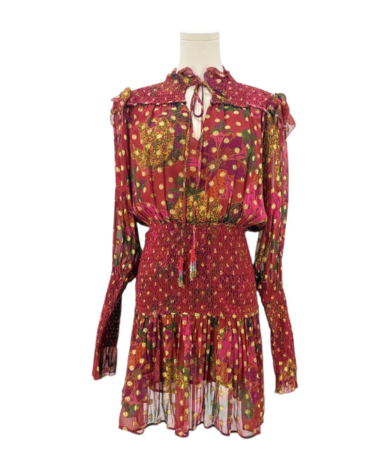 Colorful patterned dress on a mannequin against a white background