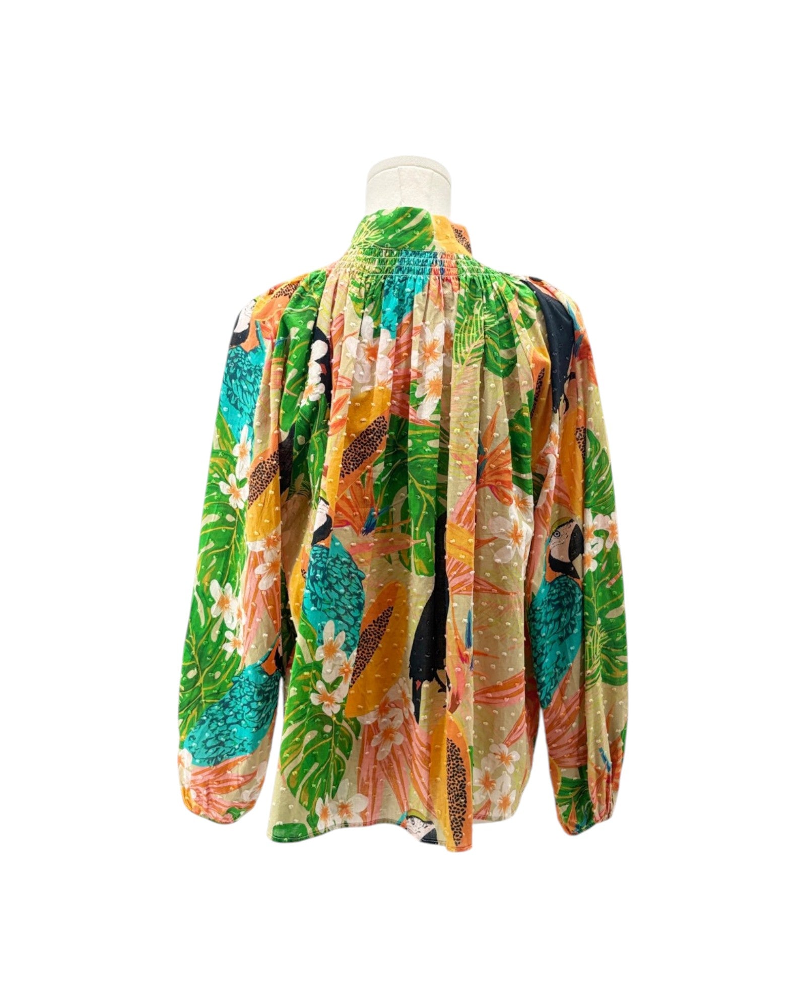 Colorful tropical-themed fabric with parrots and flowers on a white background