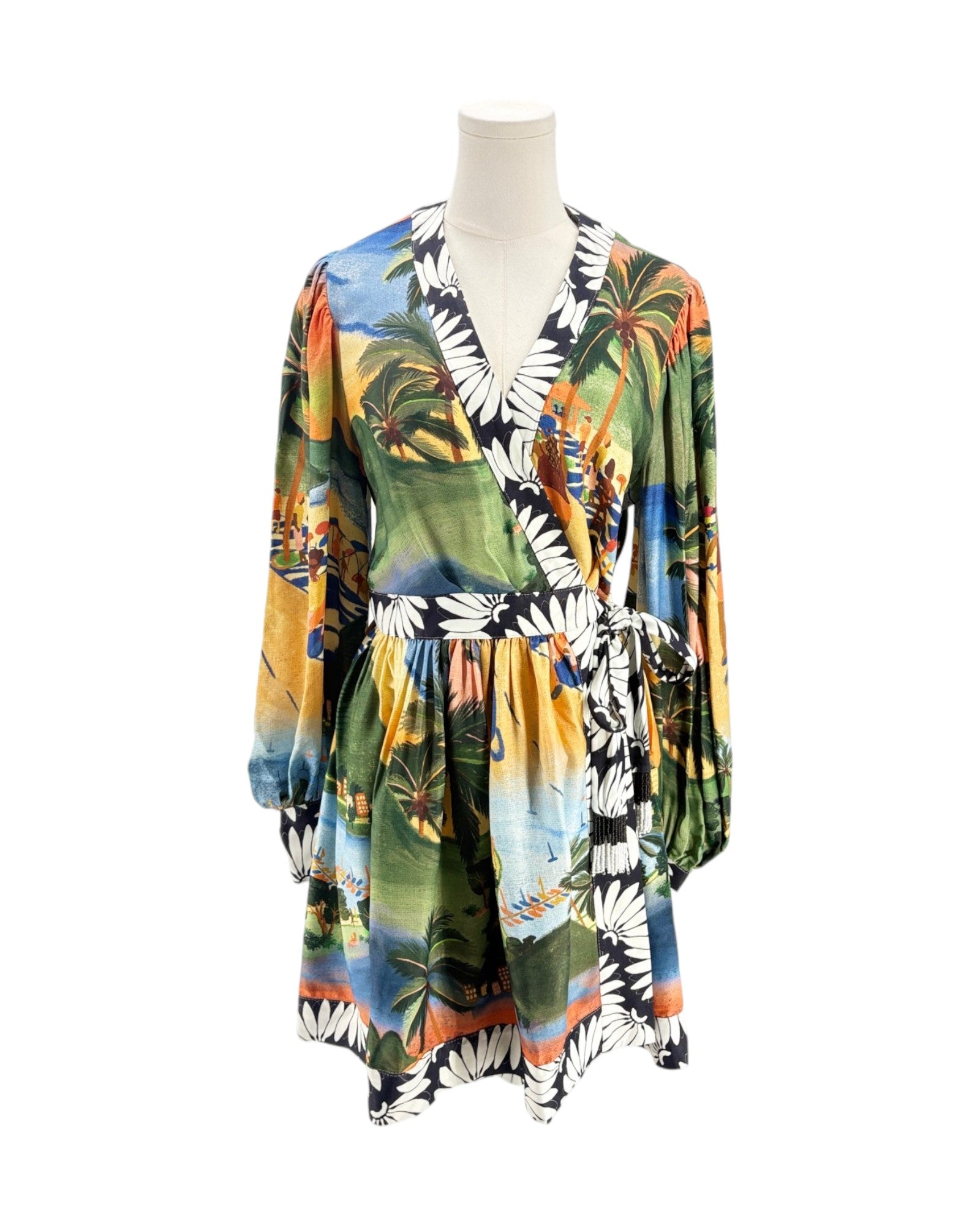 Colorful tropical print dress on a mannequin against a white background