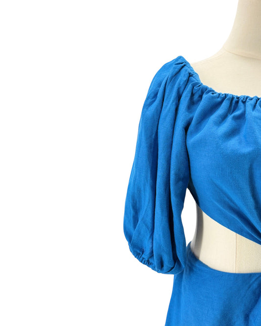 Blue dress on a mannequin with a white background