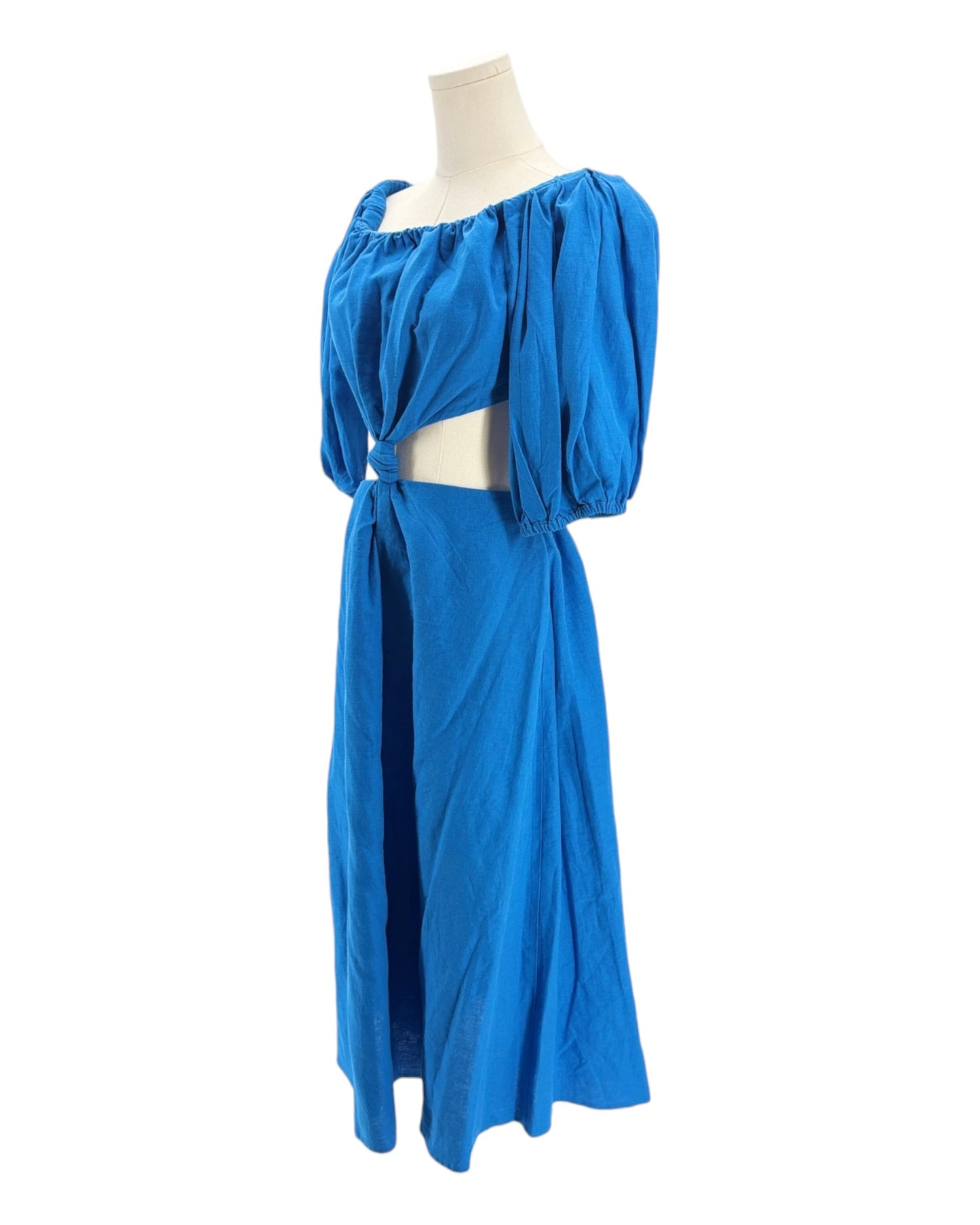 Blue dress on a mannequin against a white background
