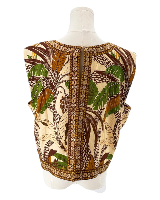 Mannequin wearing a sleeveless top with a tropical pattern on a white background