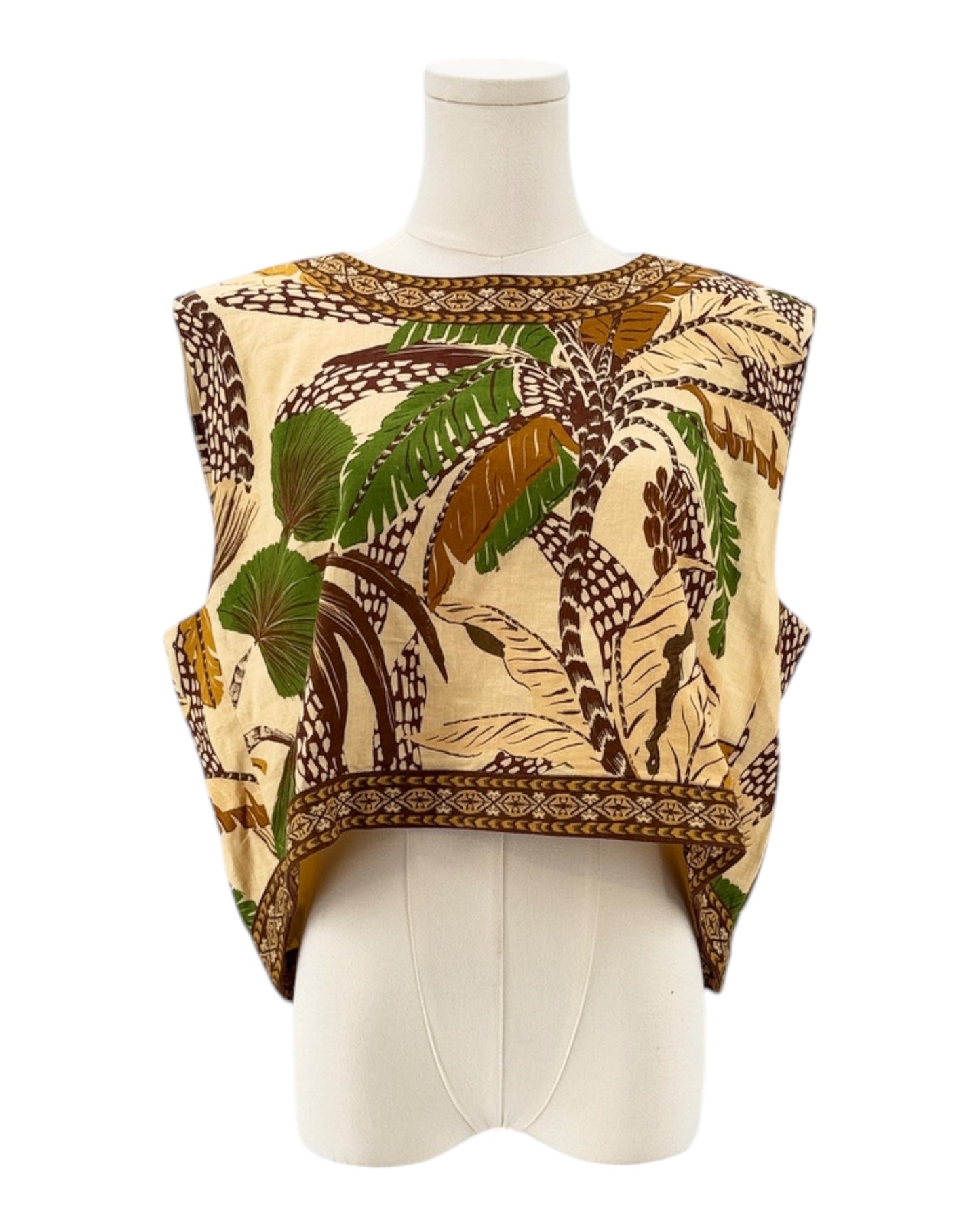 Top with a leaf pattern on a mannequin against a white background