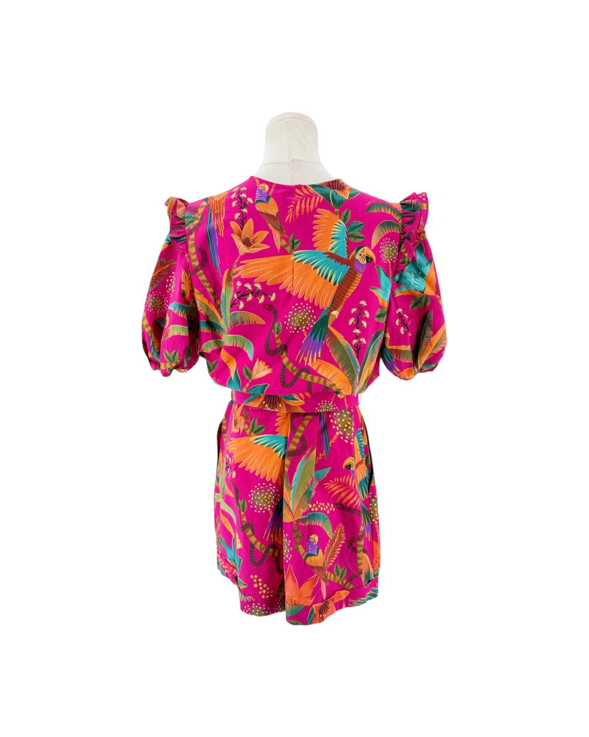 Floral and tropical birds printed deep v neck short puff sleeve romper on a mannequin on a white background