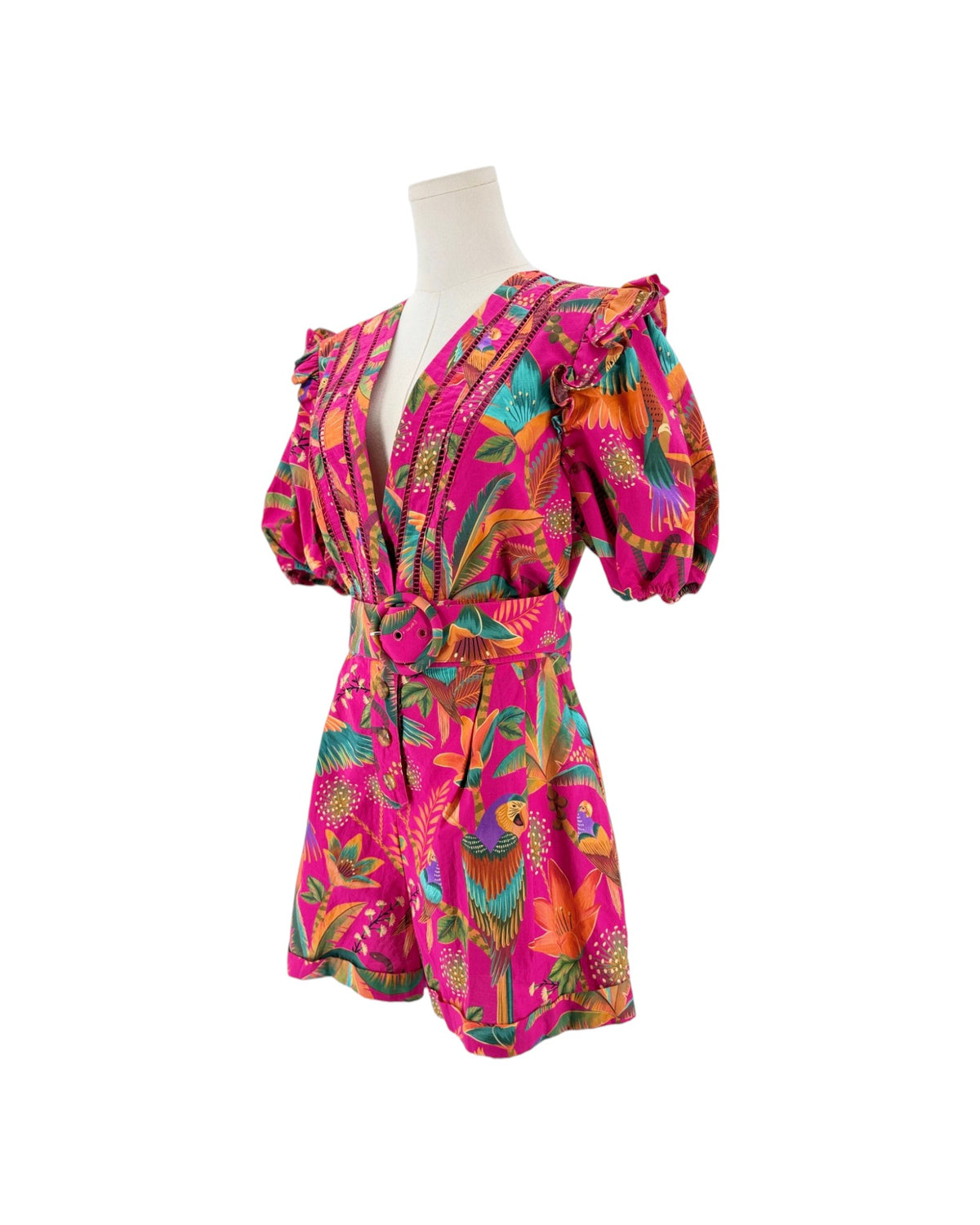 Floral and tropical birds printed deep v neck short puff sleeve romper on a mannequin on a white background