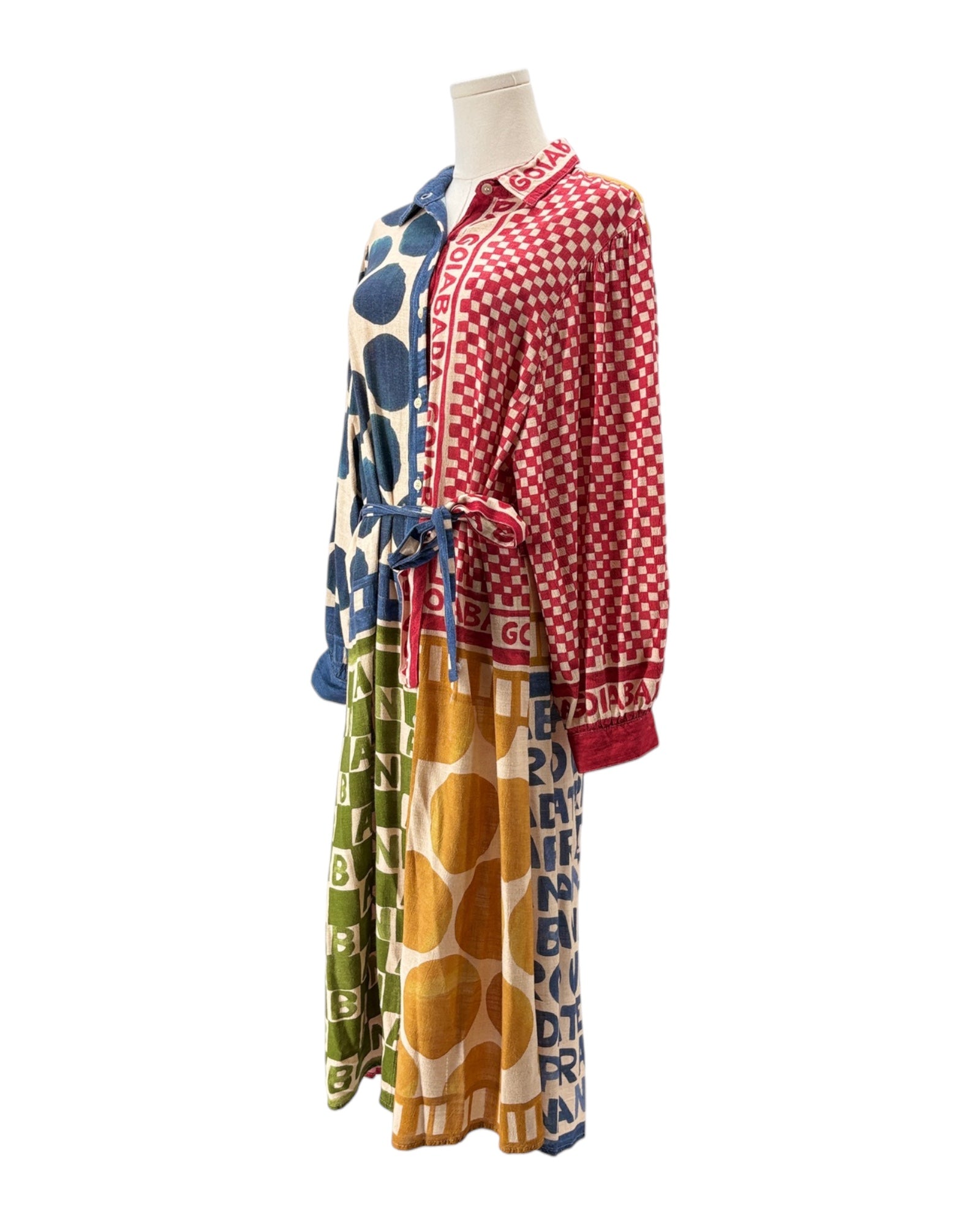 Mannequin wearing a colorful outfit with patterned clothing on a white background