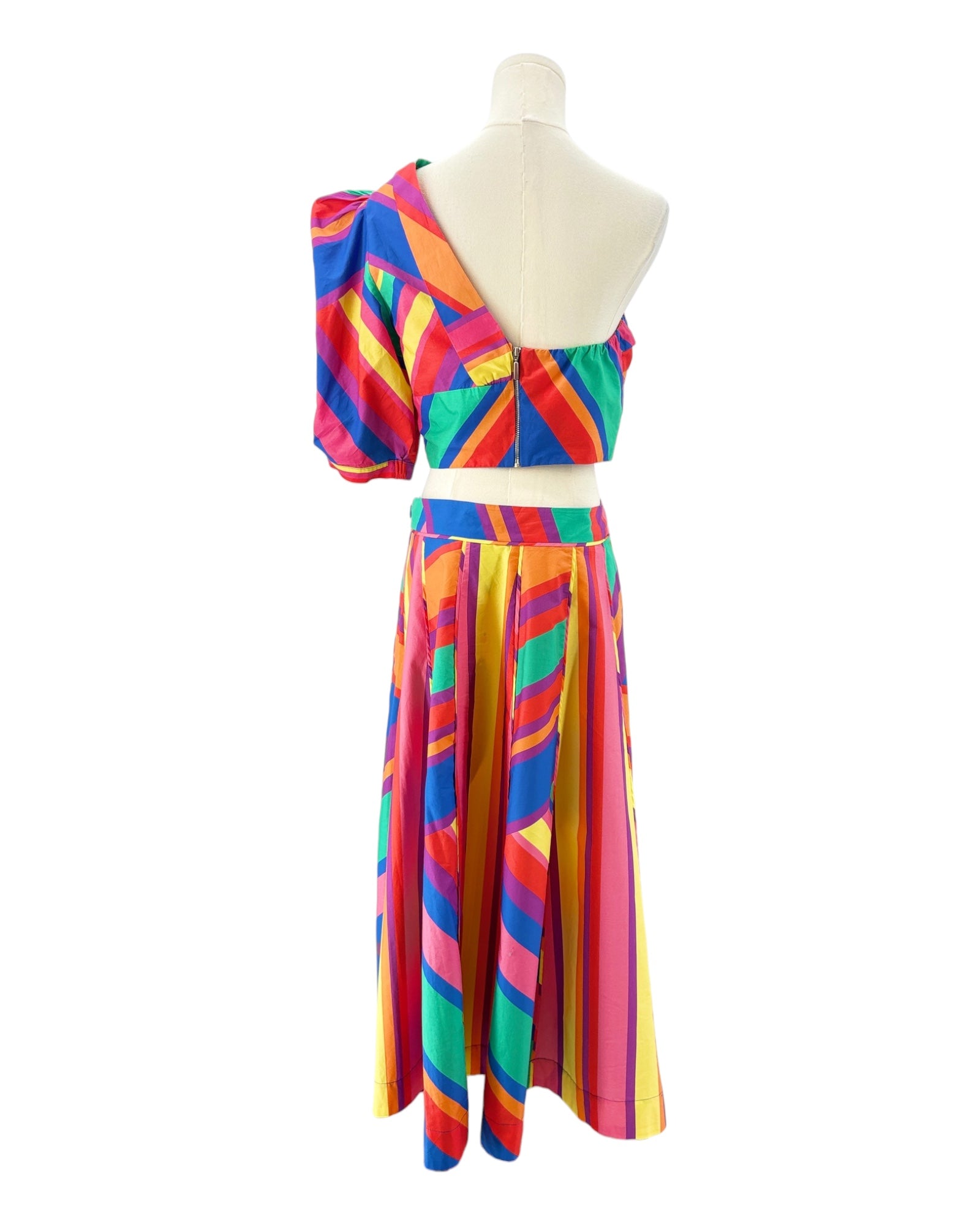 Colorful striped skirt and top on a mannequin against a white background