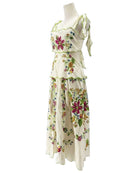 Floral dress on a mannequin against a white background