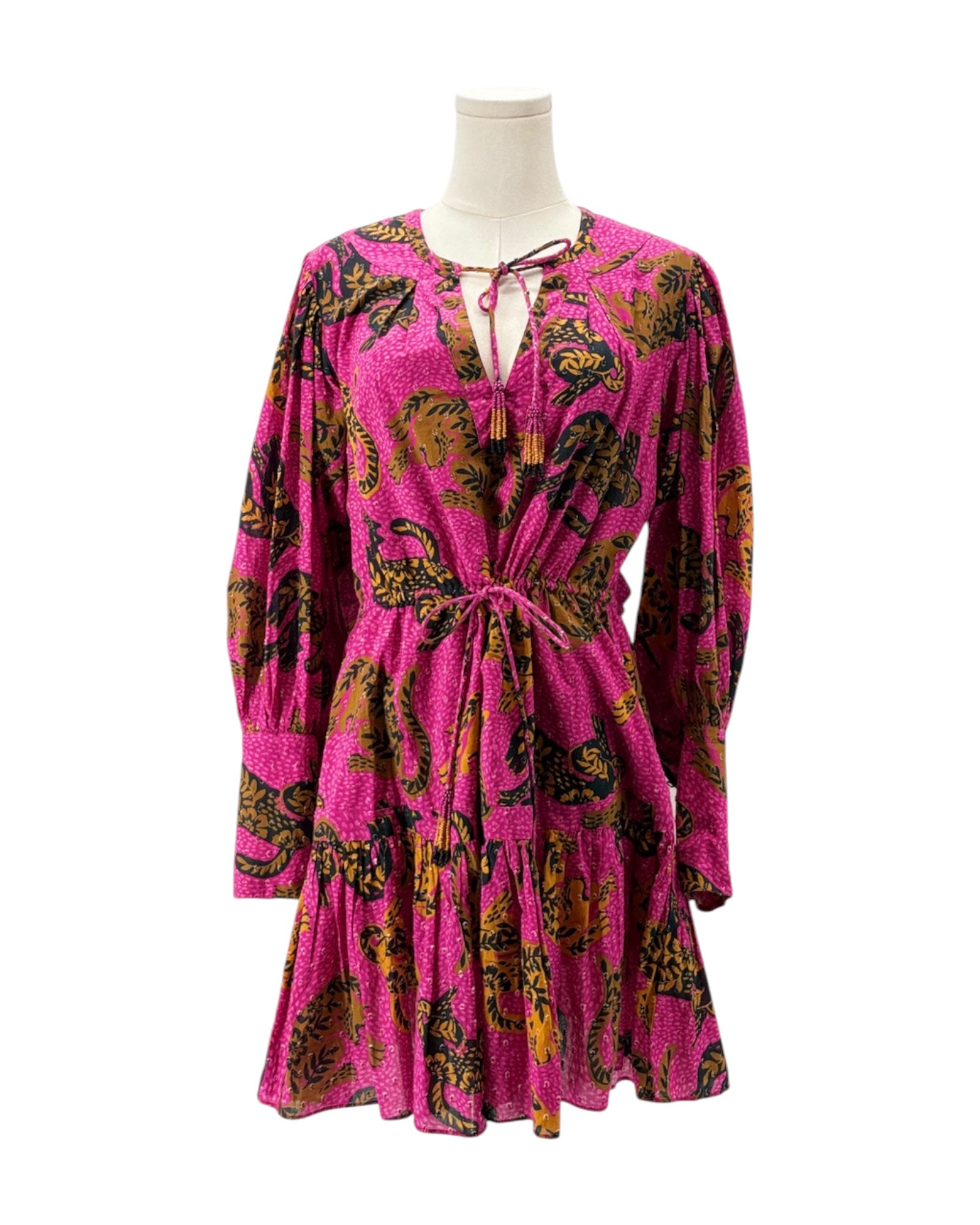 Pink dress with a pattern on a mannequin against a white background