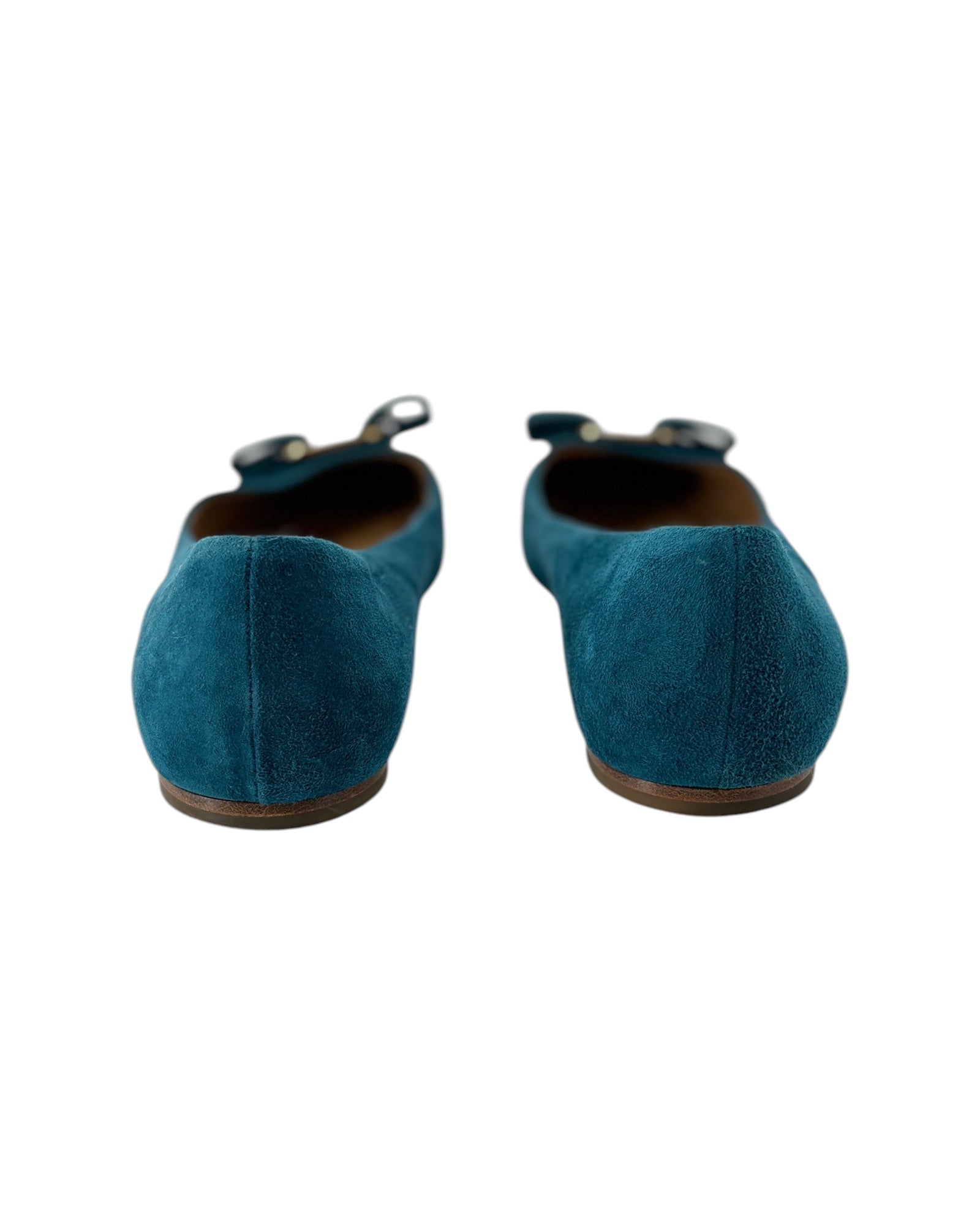 Pair of blue suede shoes on a white background