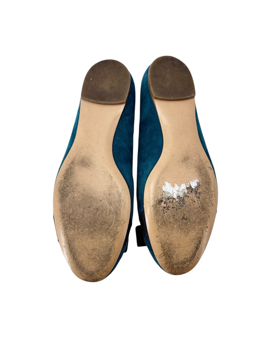 soles with a white powdery substance on a white background