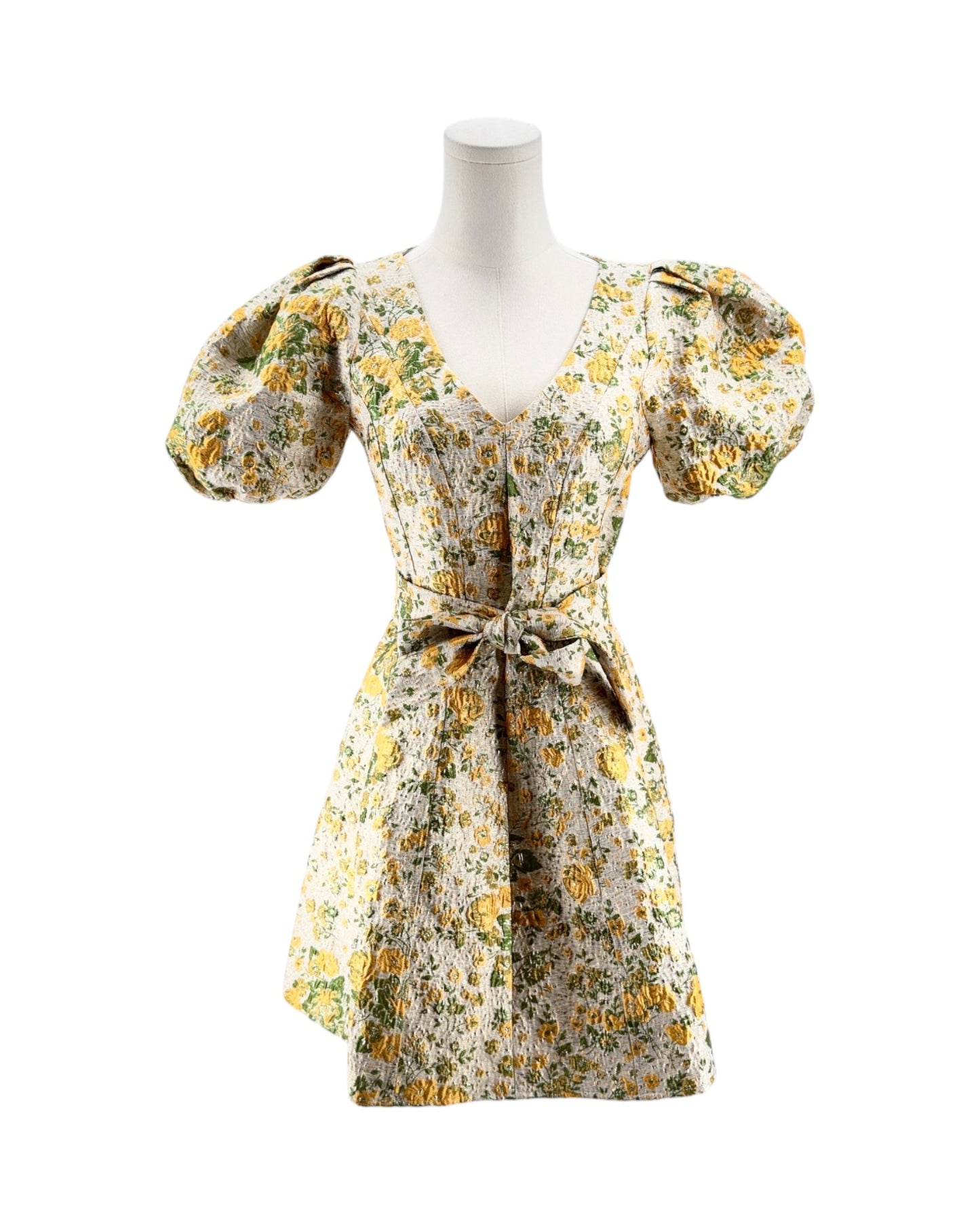 Floral dress on a mannequin against a white background