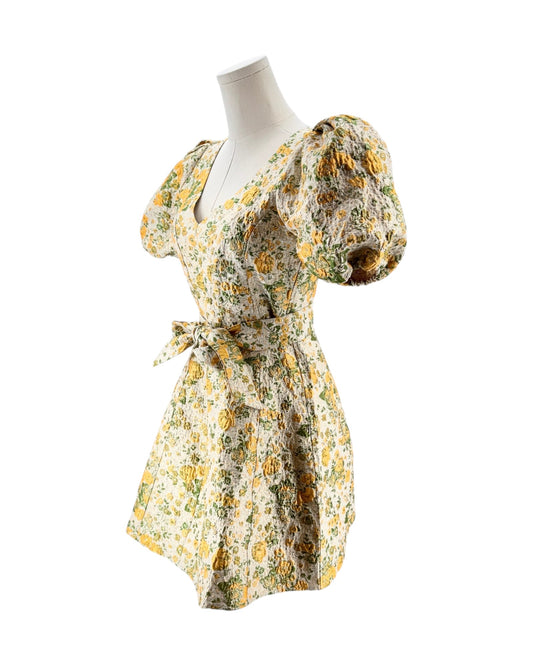 Floral dress on a mannequin against a white background