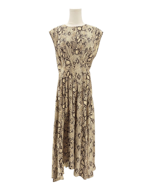 Snakeskin patterned dress on a mannequin against a white background