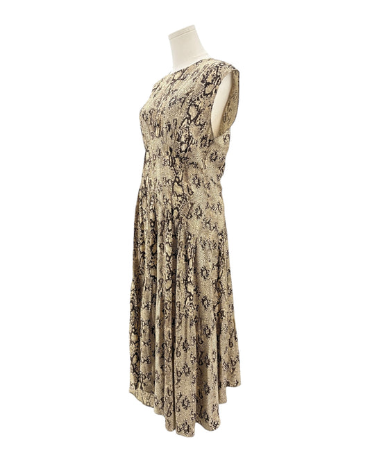 Snakeskin patterned dress on a mannequin against a white background