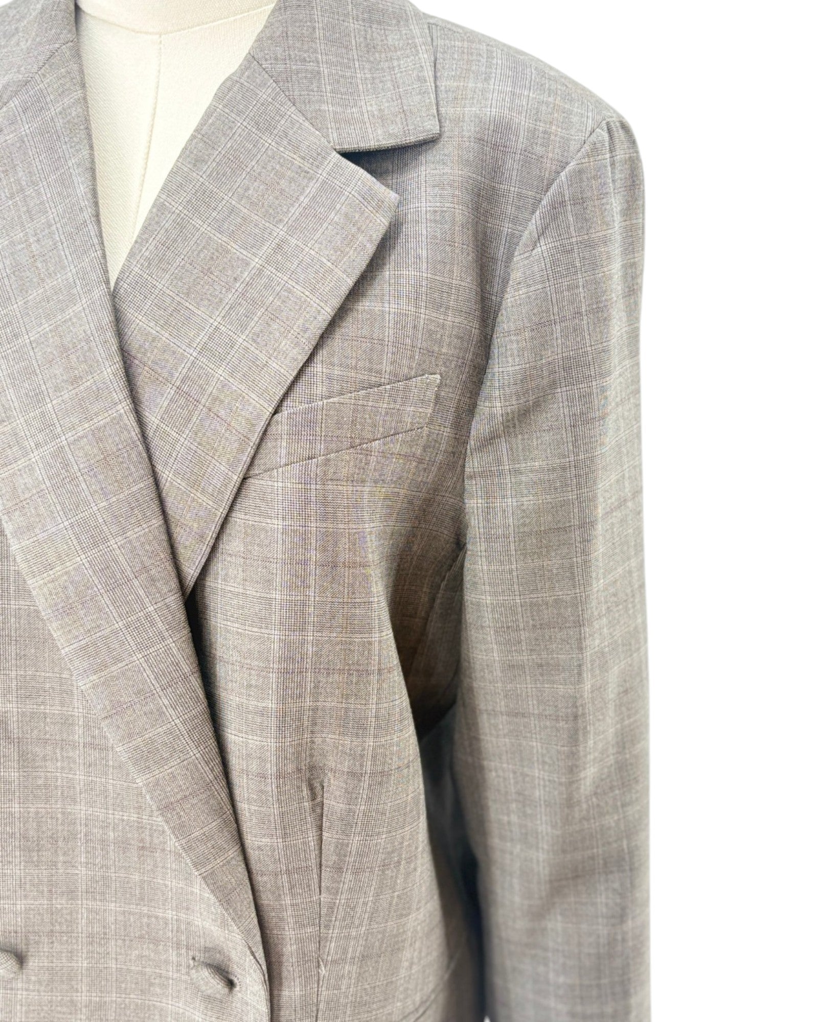 Frame gray checkered blazer on a mannequin against a white background