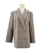Frame gray checkered blazer on a mannequin against a white background