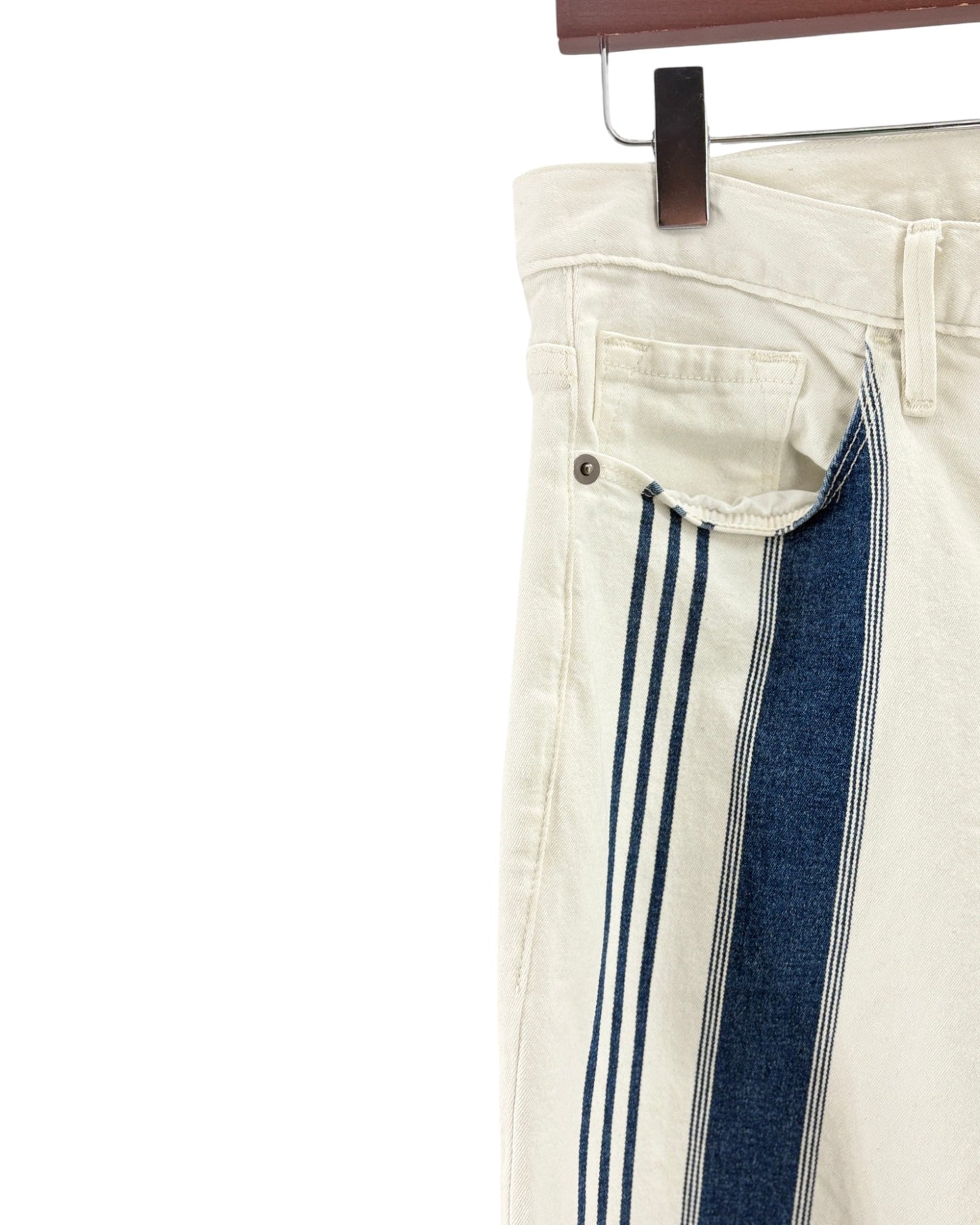 White pants with blue stripes on a hanger against a white background