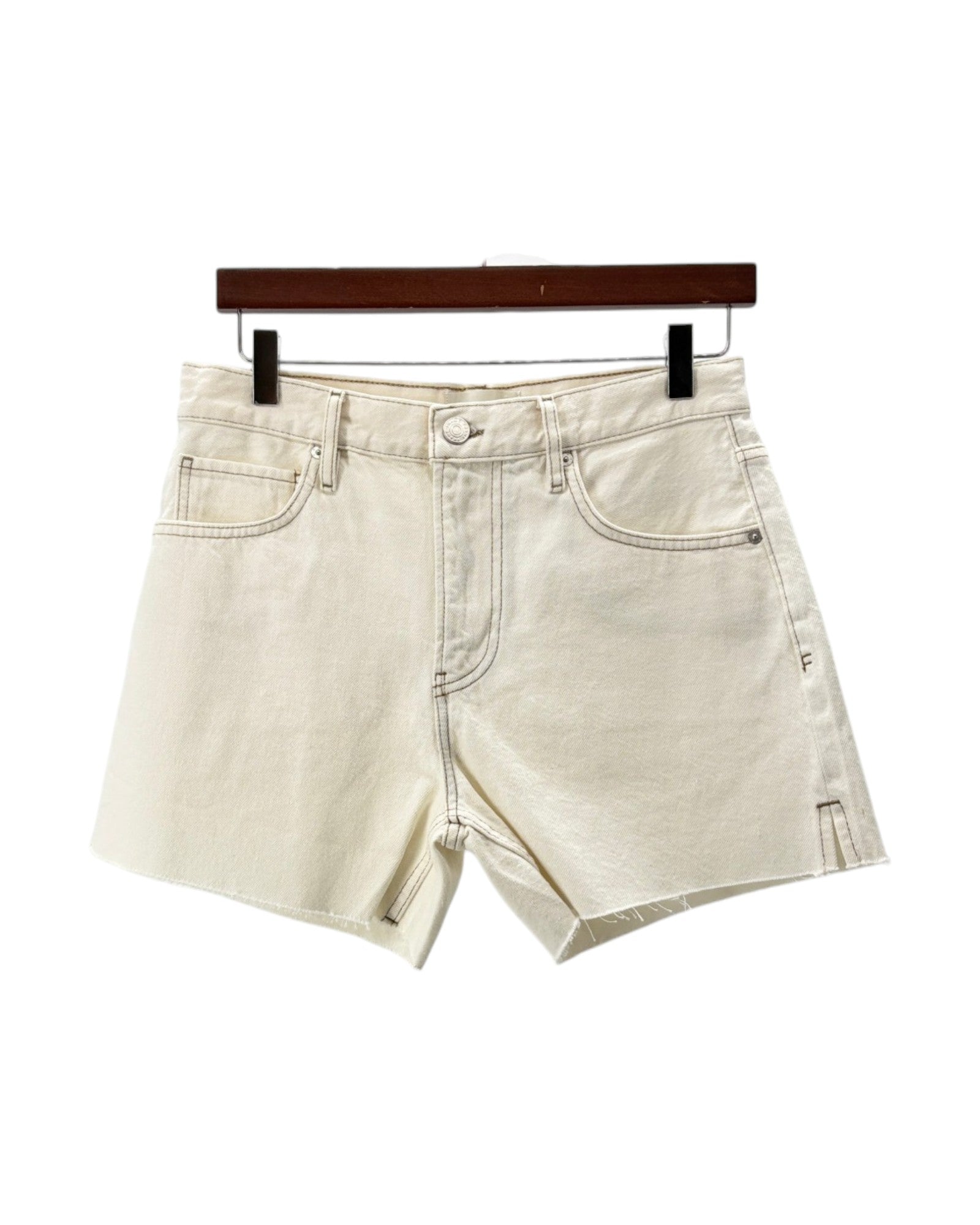 Beige denim shorts on a hanger against a white background