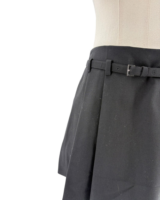 Black skirt with a belt on a mannequin against a white background