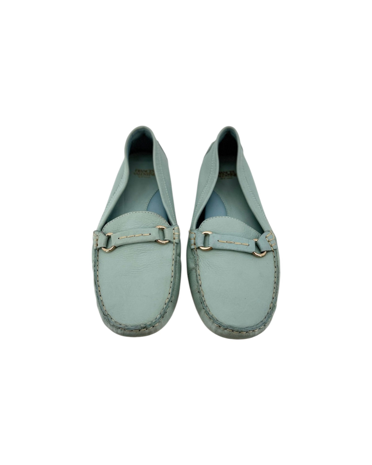 A pair of light blue-green leather penny loafers with gold-tone hardware, shown from a top-down view on a white background.