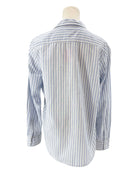 Striped shirt on a mannequin against a white background