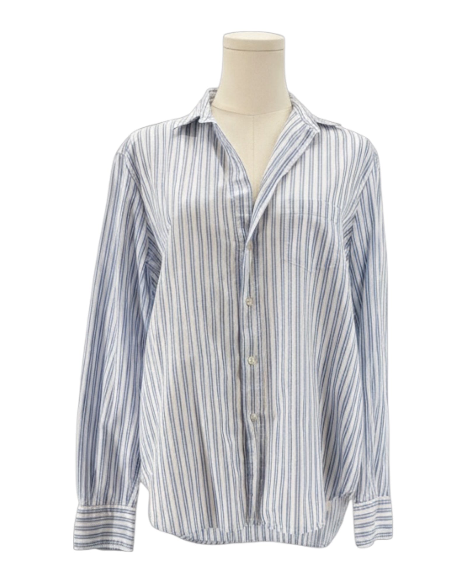 Striped shirt on a mannequin against a white background