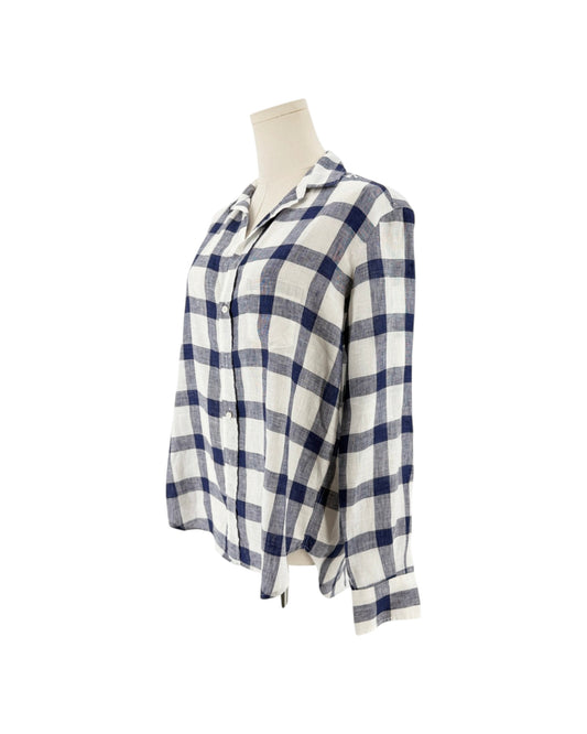 Blue and white button up, relaxed fit, chest pocket, flattering button placement with long sleeves, and button cuffs on a mannequin on a white background